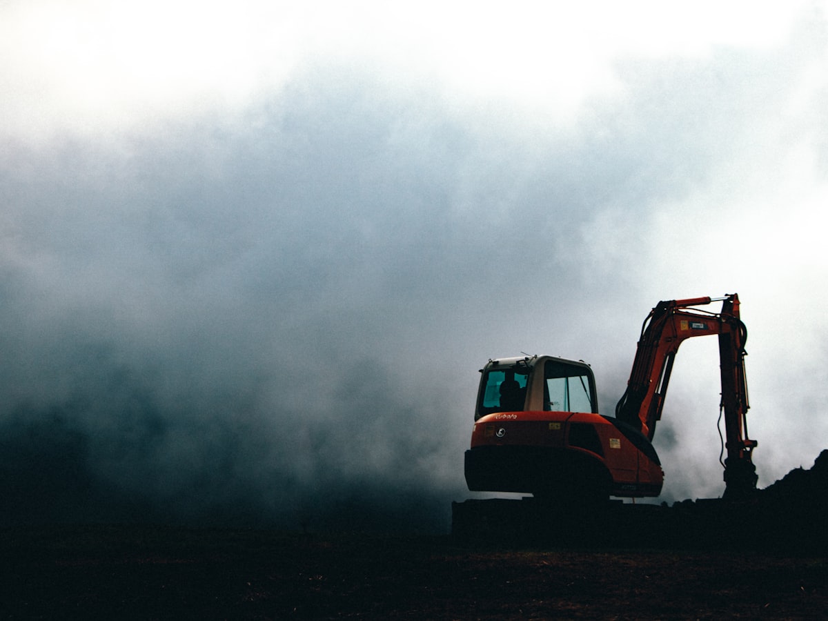 Earthmoving equipment working a rural field