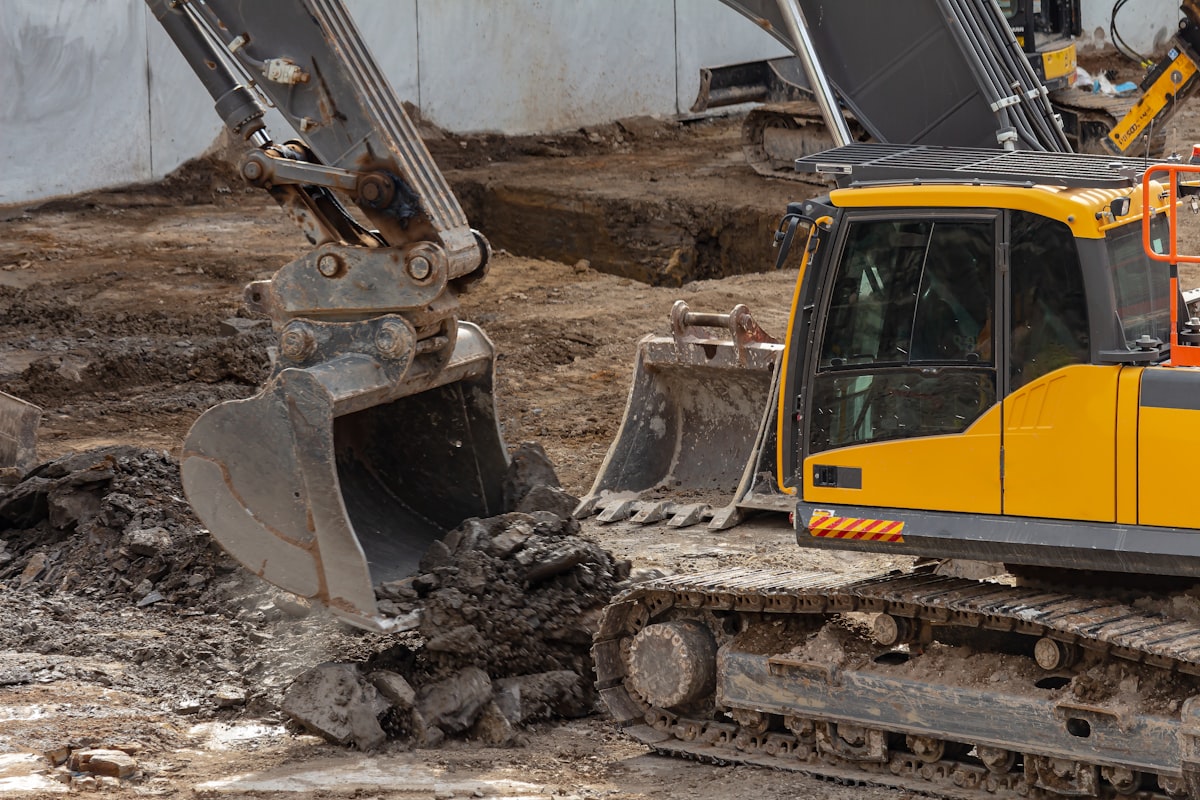 Excavator digging soil for a septic system